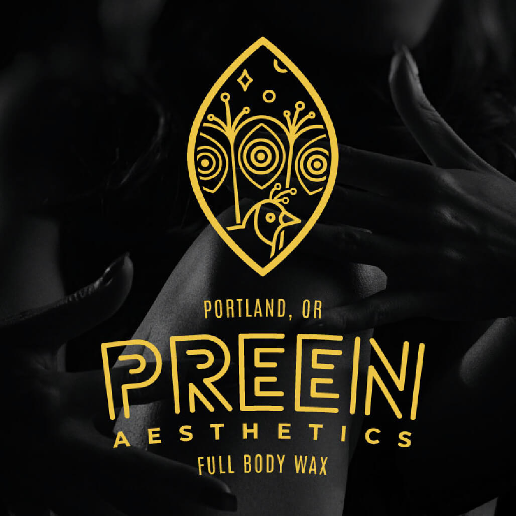 gold logo of a peacock on a dark photo background of skin